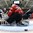 GRAND FORKS, NORTH DAKOTA - APRIL 14: Switzerland's Matteo Ritz #30 fails to make a save against Latvia's Erlends Klavins #18 in the third period during preliminary round action at the 2016 IIHF Ice Hockey U18 World Championship. (Photo by Matt Zambonin/HHOF-IIHF Images)

